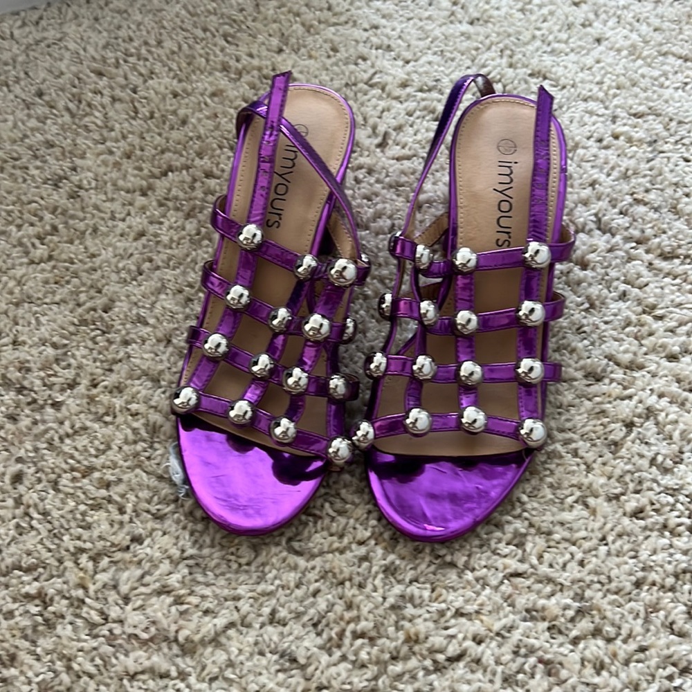 Worn Once! This purple cuties will be a show stopper any time of the season!